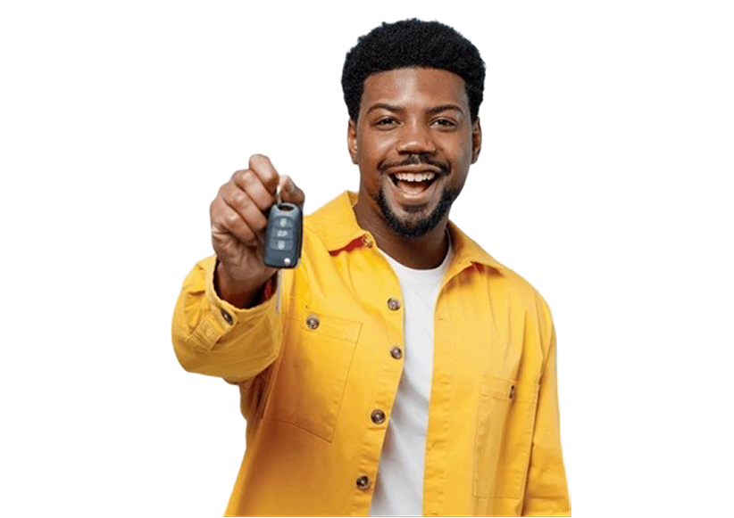 black ma in a yellow jacket and white t shirt holding a key looking happy.